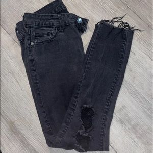 Black distressed skinny jeans
